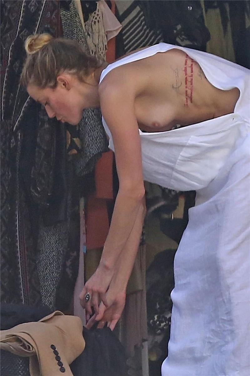 Amber Heard has a nip-slip while cleaning out her garage in LA 07302018  (1).jpg