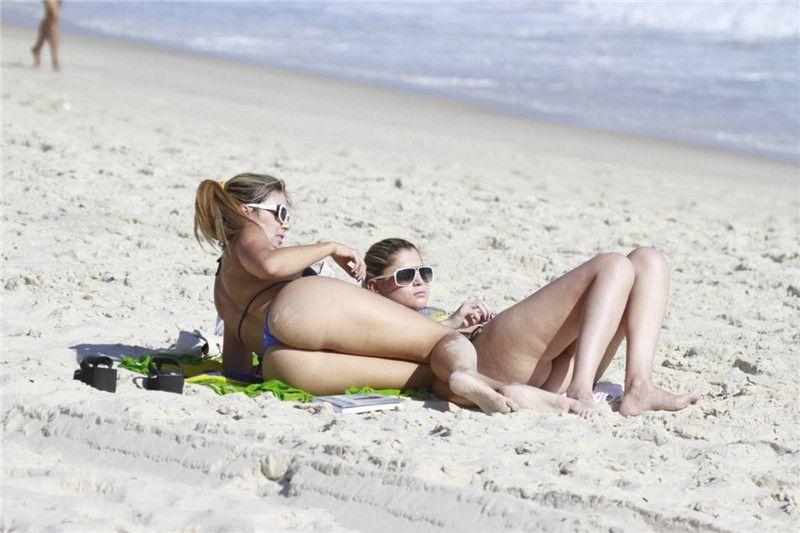 Fernanda Araldi and Larissa Gomes (Brazilian Models) sunbathing topless in Barra.jpg