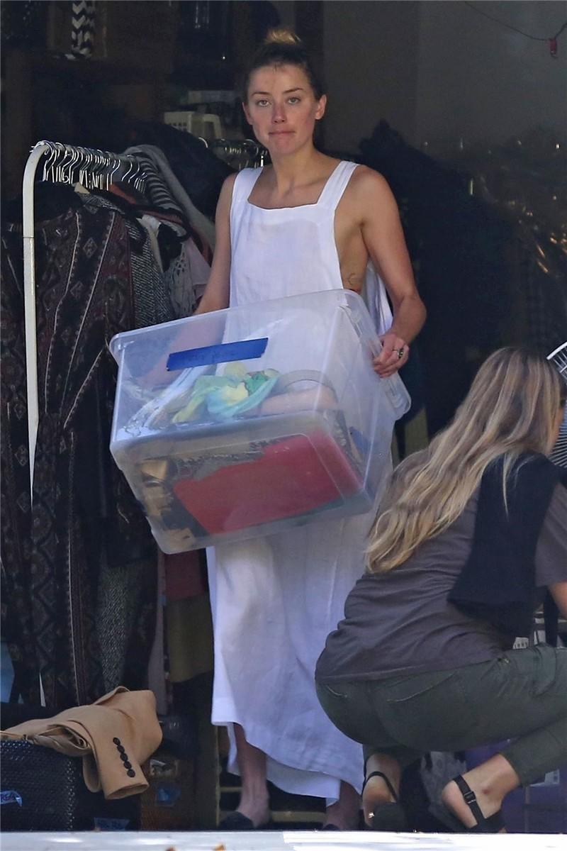 Amber Heard has a nip-slip while cleaning out her garage in LA 07302018  (2).jpg